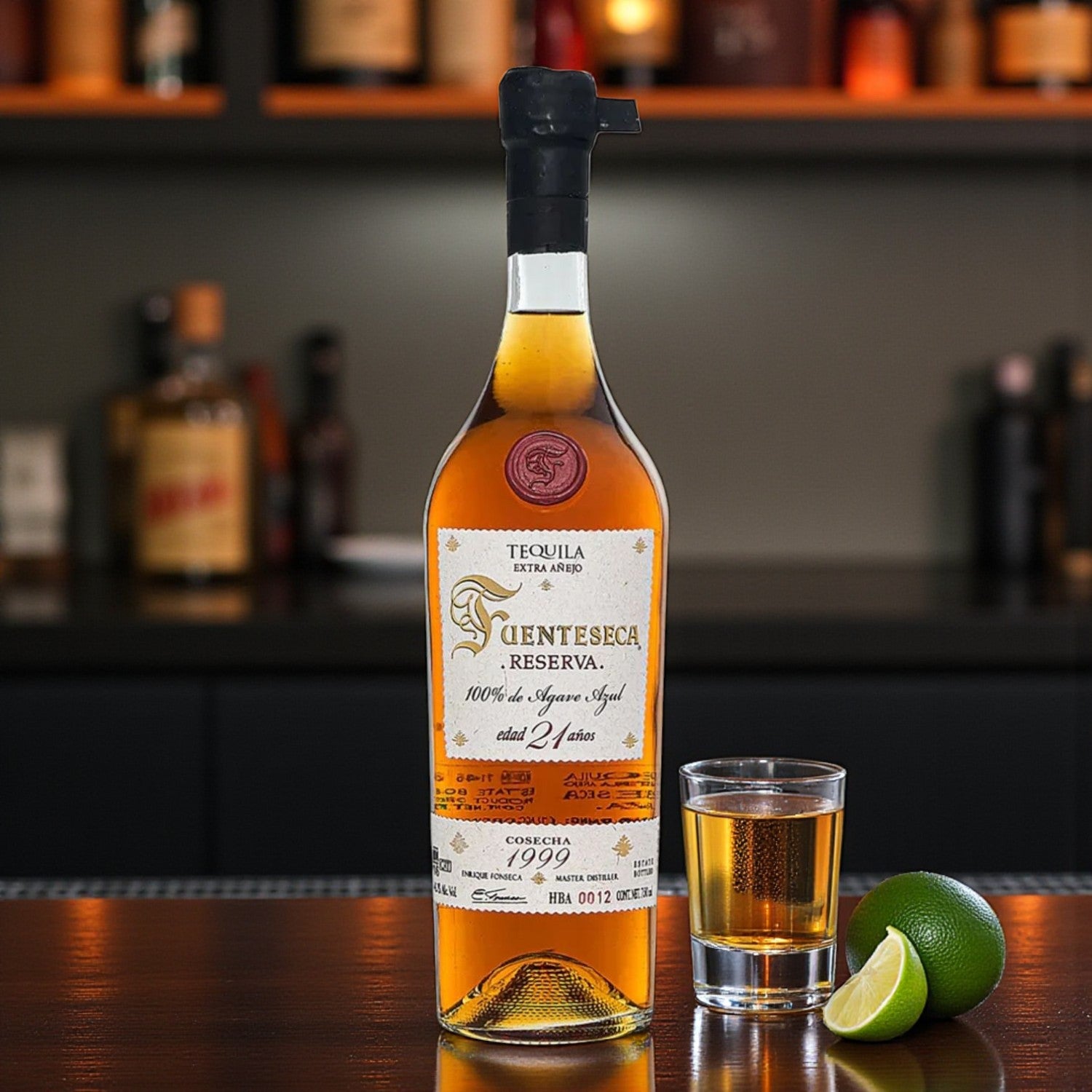Fuenteseca Reserva Extra Añejo 21 Year Tequila 750ml bottle with shot glass and limes on bar – lifestyle photo from Total Bourbon