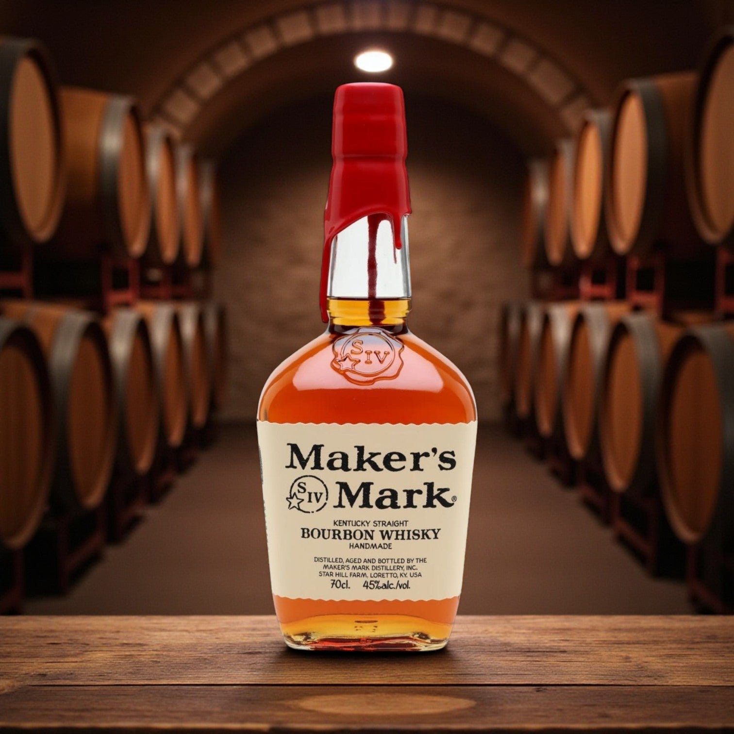 Maker’s Mark Kentucky Straight Bourbon Whisky bottle with signature red wax seal in a bourbon barrel aging room – lifestyle photo from Total Bourbon