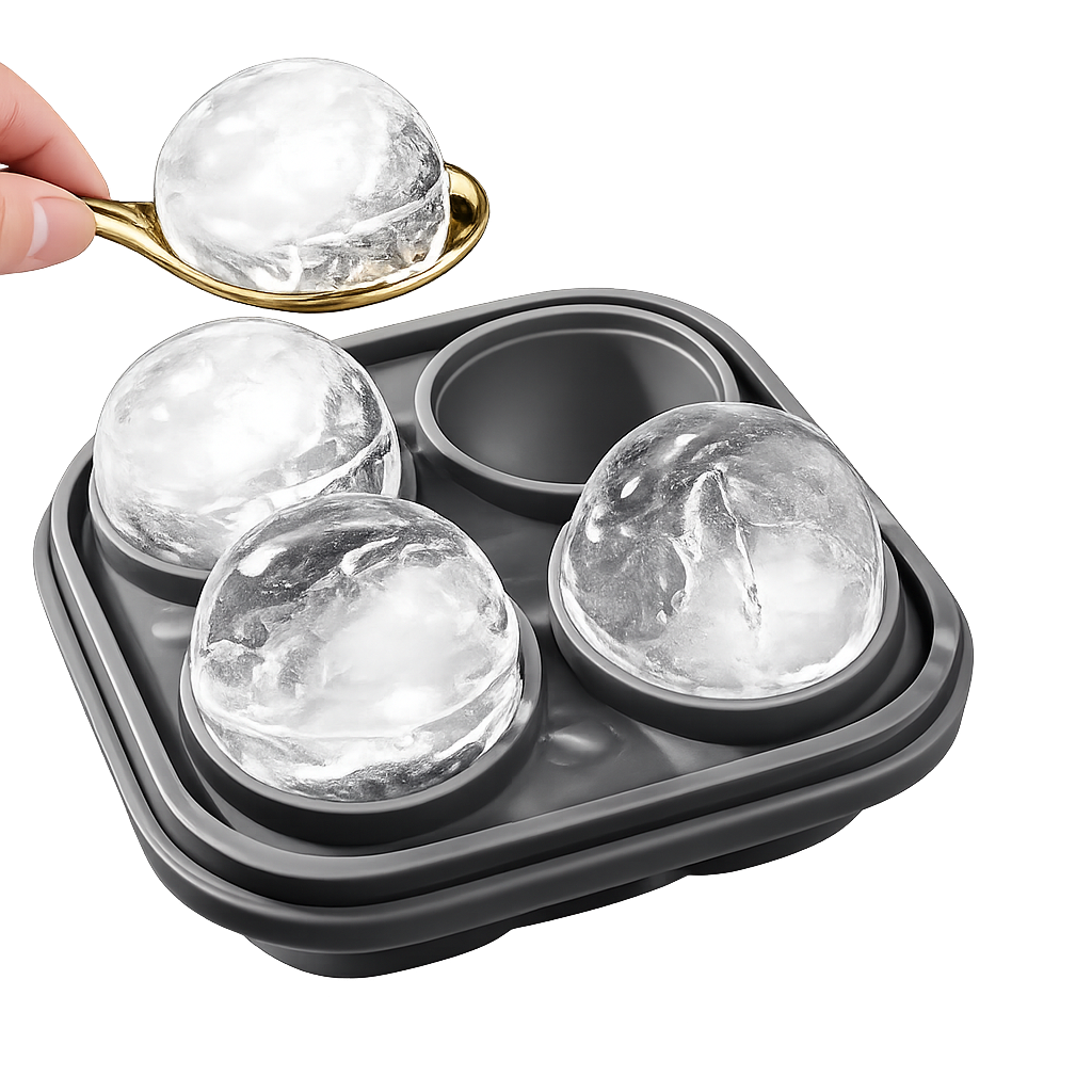 Whiskey ice molds tray with spoon and large round ice spheres on white background
