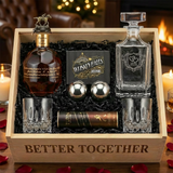 Blanton's Gold Edition Bourbon Date Night Gift Crate featuring "Better Together" etched square crystal decanter, two diamond-cut crystal old fashioned glasses, Whiskey Balls XL stainless steel ice spheres, and Turin bourbon chocolates in a wooden presentation crate with warm romantic ambient lighting