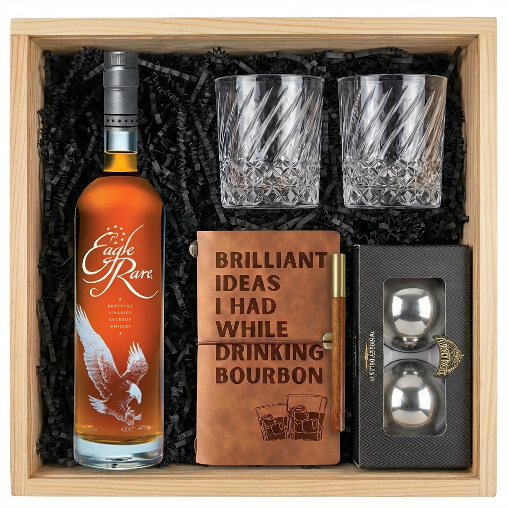 Eagle Rare 10 Year Kentucky Straight Bourbon Whiskey gift crate with orange label and white eagle illustration, crystal-cut old fashioned glasses with diagonal twisted swirl pattern, tan leather bourbon journal and pen set, and Stanley&