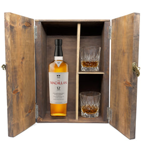 The Macallan 12 Year Double Cask in a fitted wooden gift box with two crystal old-fashioned glasses, studio white