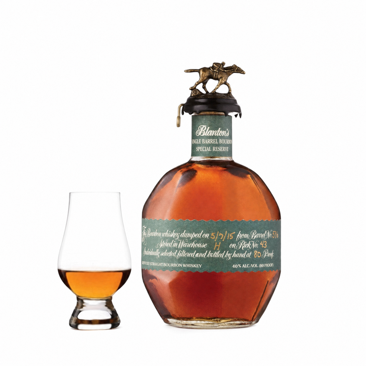 Blanton's Green Special Reserve single barrel bourbon bottle beside a Glencairn tasting glass on white