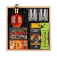 Blanton's Gold Edition bourbon gift crate with two crystal-cut glasses, whiskey stones, ground coffee, dark chocolate, and pistachios nested in a natural wood crate.