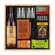 Old Rip Van Winkle 10 Year bourbon gift crate with two glasses, a leather bourbon journal and pen, whiskey stones, coffee, chocolate, and pistachios in a wood crate.