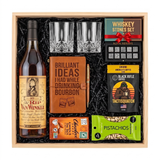 Old Rip Van Winkle 10 Year bourbon gift crate with two glasses, a leather bourbon journal and pen, whiskey stones, coffee, chocolate, and pistachios in a wood crate.