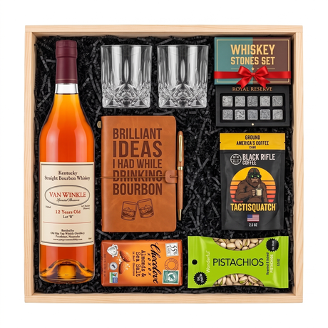 Pappy Van Winkle 12 Year Lot B bourbon gift crate with two glasses, a leather bourbon journal and pen, whiskey stones, coffee, chocolate, and pistachios in a wood crate.