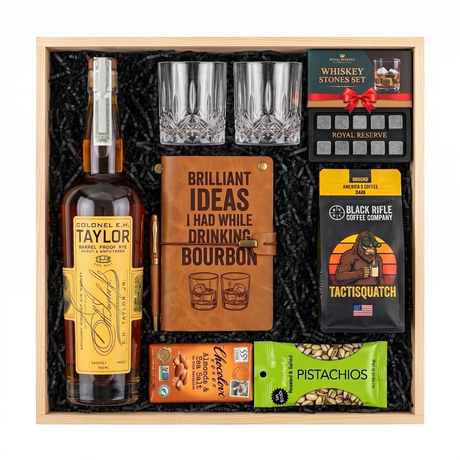Colonel E.H. Taylor Barrel Proof Rye gift crate with two glasses, a leather bourbon journal and pen, whiskey stones, coffee, chocolate, and pistachios in a wood crate.