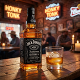 Jack Daniel's Old No. 7 Tennessee Sour Mash Whiskey bottle with iconic black and white label displayed on rustic wooden bar counter with rocks glass and warm Tennessee honky-tonk ambiance