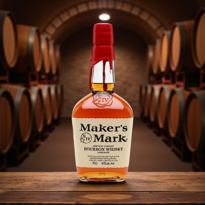 Maker’s Mark Kentucky Straight Bourbon Whisky bottle with signature red wax seal in a bourbon barrel aging room – lifestyle photo from Total Bourbon