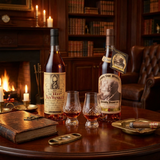 Pappy Van Winkle "The Bookends" Collection featuring Old Rip Van Winkle 10 Year 107 Proof and Pappy Van Winkle Family Reserve 23 Year Limited Edition bourbon bottles displayed in an elegant library setting with crystal glassware – 750ml collector's bundle