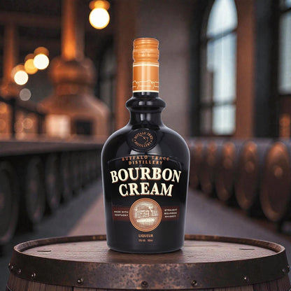 Buffalo Trace Bourbon Cream Liqueur 750ml bottle displayed on a barrel inside a Kentucky distillery, showcasing rich bourbon cream whiskey