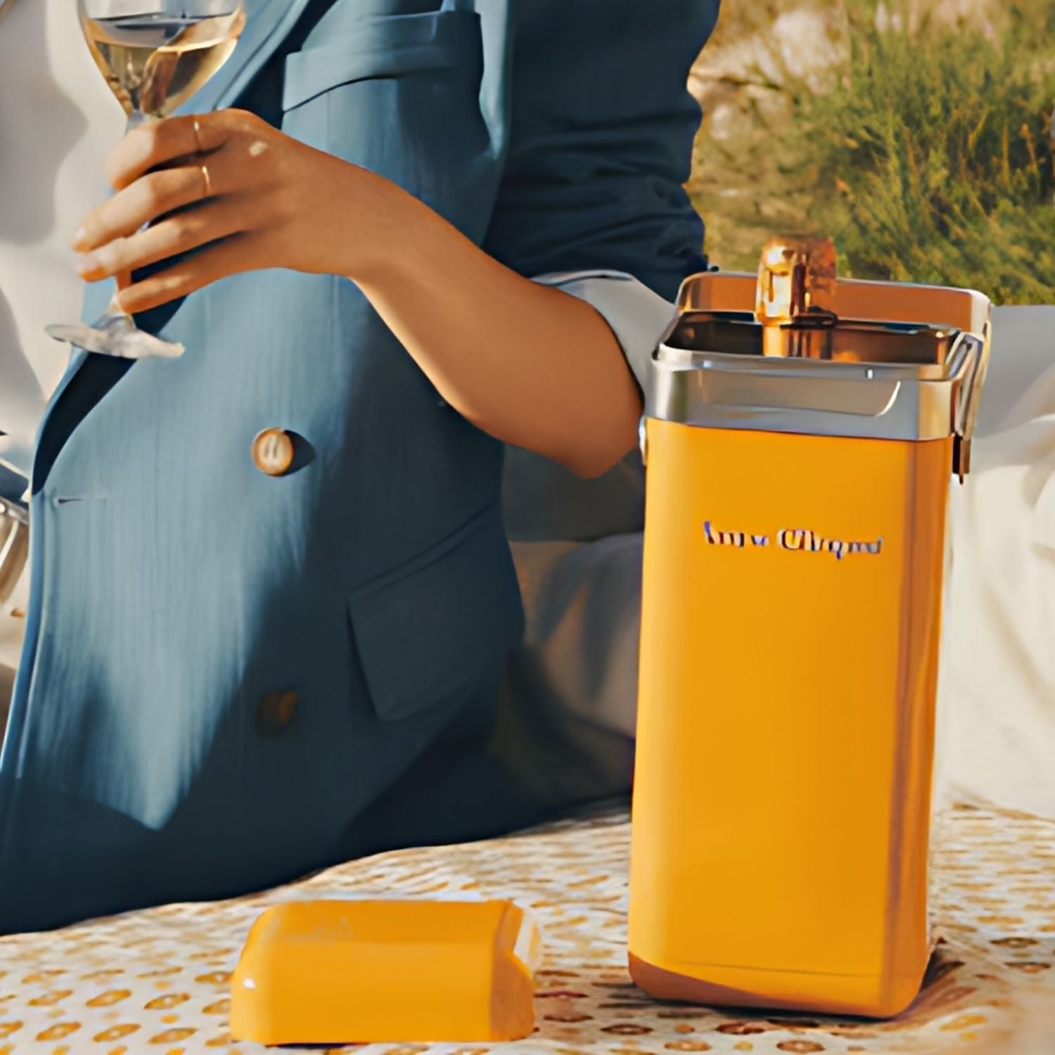 Veuve Clicquot Brut Yellow Label Champagne with cooler shown at a picnic setting – lifestyle photo from Total Bourbon